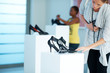 Cute young woman selecting shoes at a store