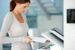 Attractive young woman photocopying at the office Attractive young woman photocopying at the office