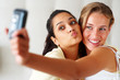 Self photography - Young girls holding cellphone Self photography - Young girls holding cellphone