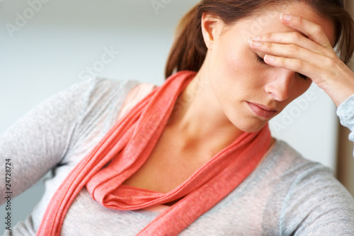 Photo: Beautiful young woman looking depressed Beautiful young woman looking depressed
