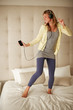 Pretty young female enjoying listening to music