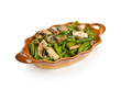 String beans with champignons in a brown bowl