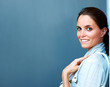 Sweet young woman smiling against grey background