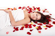 Beautiful girl in rose petal.