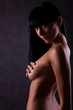 The sexual naked girl hides a breast