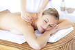 Positive woman having a back massage Positive woman having a back massage