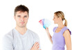 Young caucasian couple choosing colors for painting their room