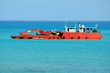 Red big barge in the sea Red big barge in the sea