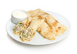 Russian pancakes stuffed by sliced herring and eggs