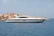 fast luxury yacht anchored in bay.