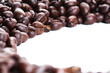 Coffee beans arranged in a circular frame, closeup Coffee beans arranged in a circular frame, closeup