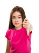 Girl showing thumb down sign isolated on white