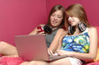 Teens using mobile phone and computer