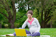 Photo: Beautiful pregnant woman in the park Beautiful pregnant woman in the park