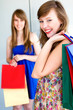 Happy young women with shopping bags