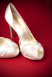 Bride's shoes on red background
