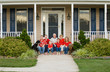Photo: Happy Family in Front of Their Home Happy Family in Front of Their Home