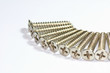 silver screws on white background silver screws on white background