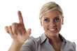 Business woman pressing a button Business woman pressing a button