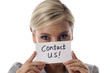 Smiling business woman holding a card- Contact Us! Smiling business woman holding a card- Contact Us!