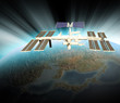 Satellite Orbiting in Space Above Earth