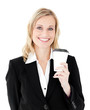 Joyful businesswoman holding a coffee smiling at the camera Joyful businesswoman holding a coffee smiling at the camera