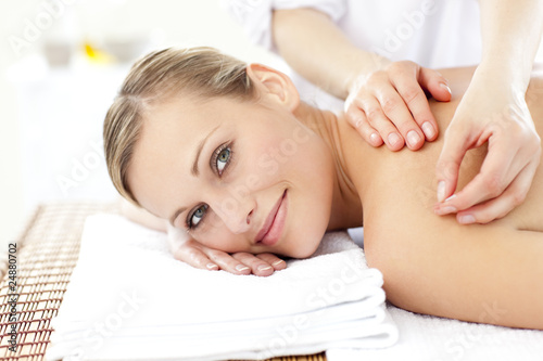 Photo: Smiling caucasian woman receiving an acupuncture treatment Smiling caucasian woman receiving an acupuncture treatment