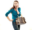 Young shocked brunette shopping isolated on white