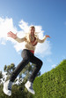 Photo: Young Woman Jumping On Trampoline Caught In Mid Air Young Woman Jumping On Trampoline Caught In Mid Air