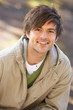 Photo: Portrait Of Young Man In Autumn Park Portrait Of Young Man In Autumn Park