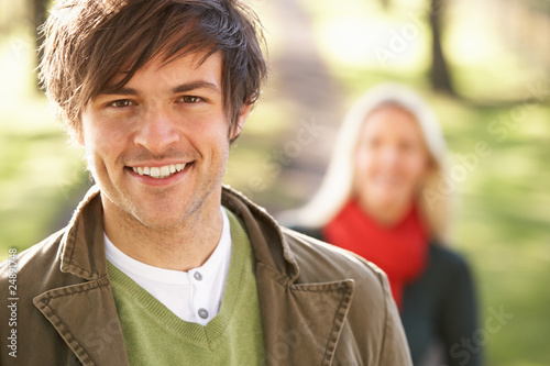 Photo: Portrait Of Romantic Young Couple In Autumn Park Portrait Of Romantic Young Couple In Autumn Park
