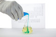 a chemest mixes chemicals for a violent reaction