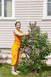 woman doing work in her garden woman doing work in her garden
