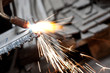 blowtorch cutting metal in factory and sparks