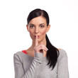 Woman making a keep it quiet - isolated