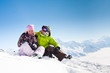 Young happy couple in winter mountains