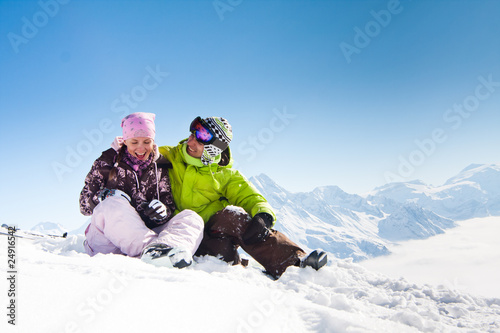 Photo: Young happy couple in winter mountains Young happy couple in winter mountains