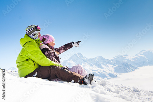 Photo : Young happy couple in winter mountains Young happy couple in winter mountains