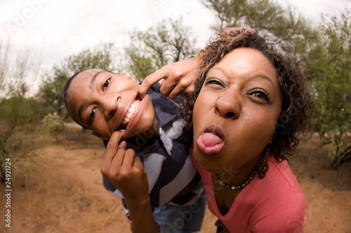 Photo: African-American family making faces African-American family making faces