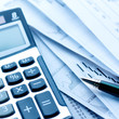 Financial concept. Calculator and pen.