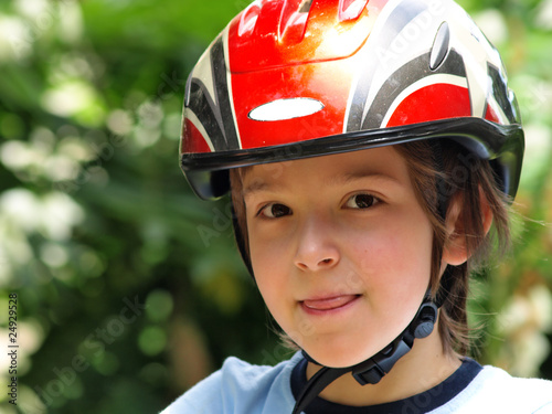 Photo: lBoy with a bike helmet lBoy with a bike helmet