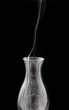 Smoke leaving an extinct old lamp Smoke leaving an extinct old lamp