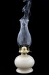 Smoke leaving an extinct old lamp Smoke leaving an extinct old lamp