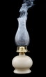 Smoke leaving an extinct old lamp Smoke leaving an extinct old lamp