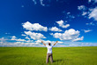 man on field rising up hands