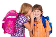 portrait of a blonde girl whispering in boy's ear