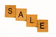 sale spelled out in wood tiles
