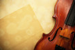 Photo: old violin and empty yellow paper old violin and empty yellow paper