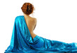 Woman in blue cloth, rear view.