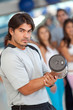 Photo: man lifting free weights man lifting free weights